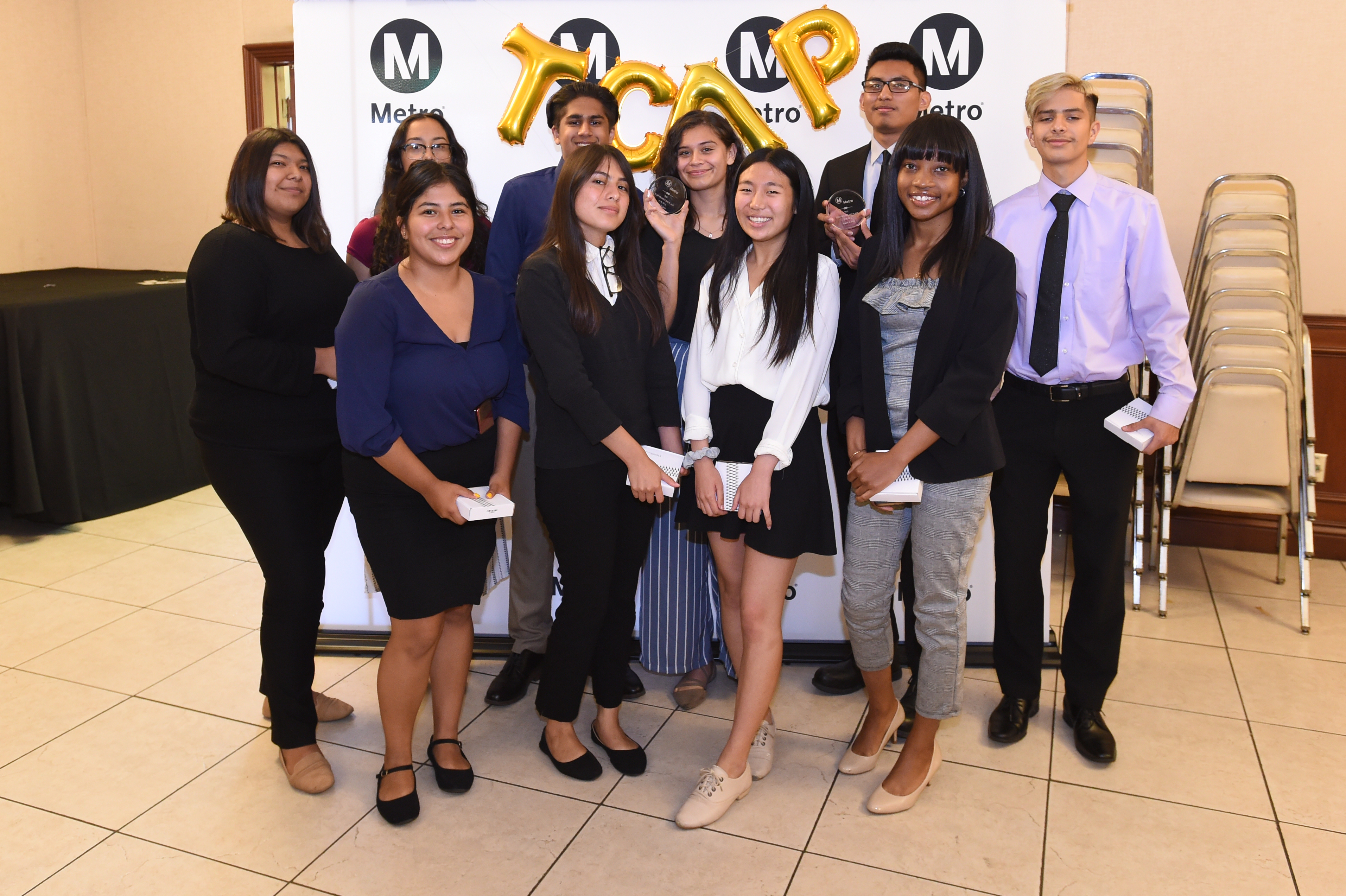Ten students at the Transportation Career Academy Program graduation.