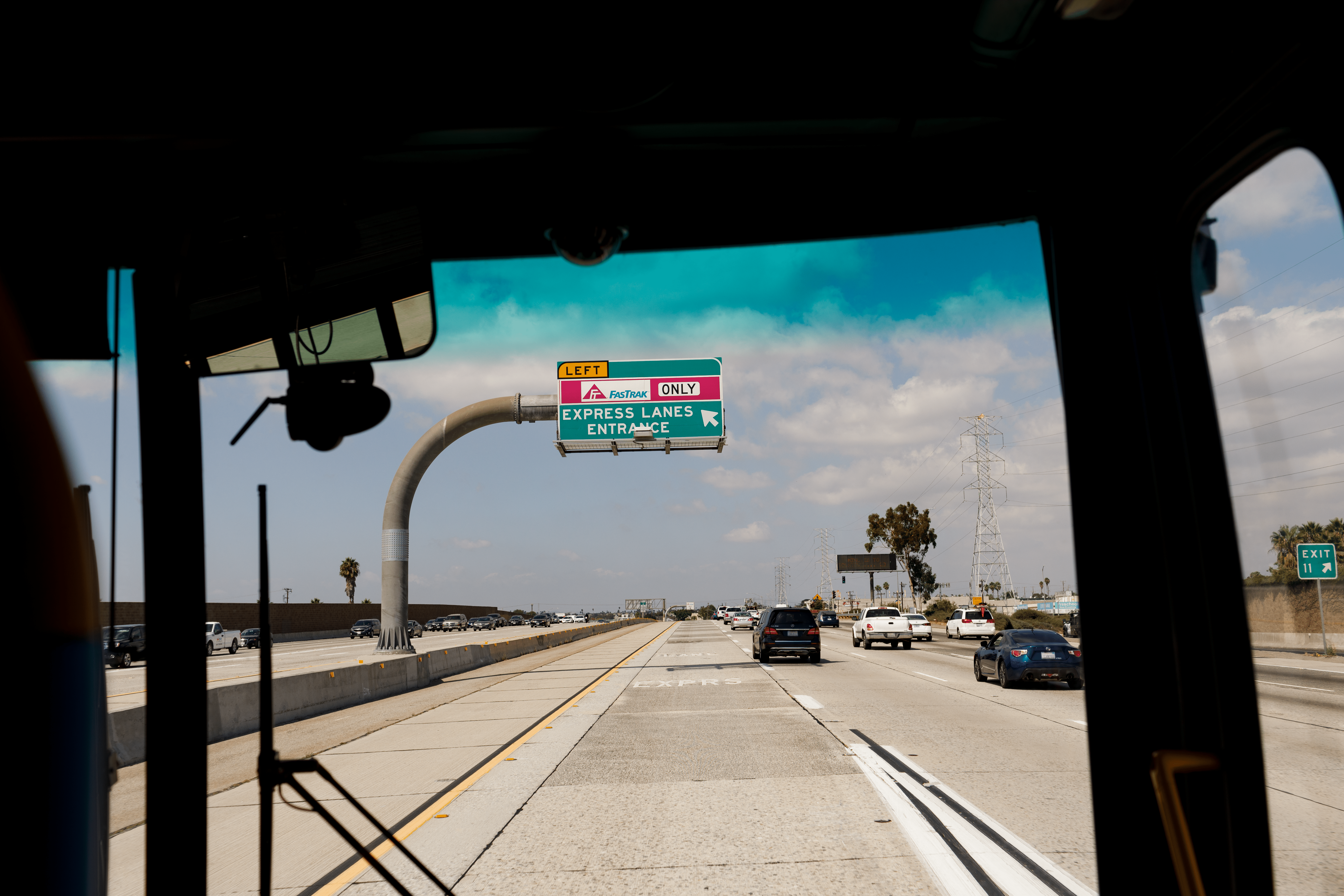Photo of a Los Angeles highway through the windshield of a Metro bus.